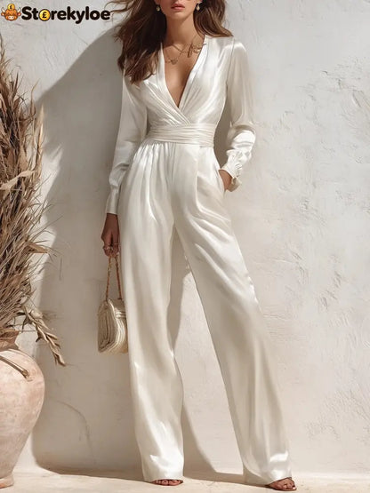 Satin Surplice V‑Neck Long Sleeve Waist‑Tied Wide Leg Elegant Jumpsuit With Pockets - White / S